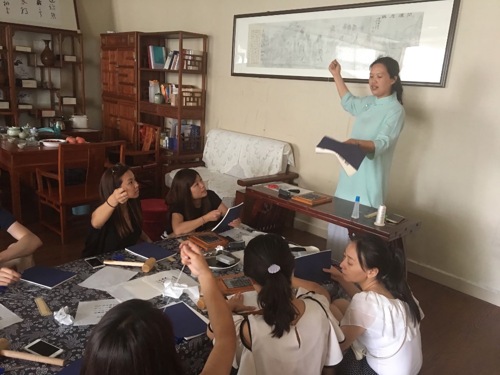 Students learn about traditional book binding techniques