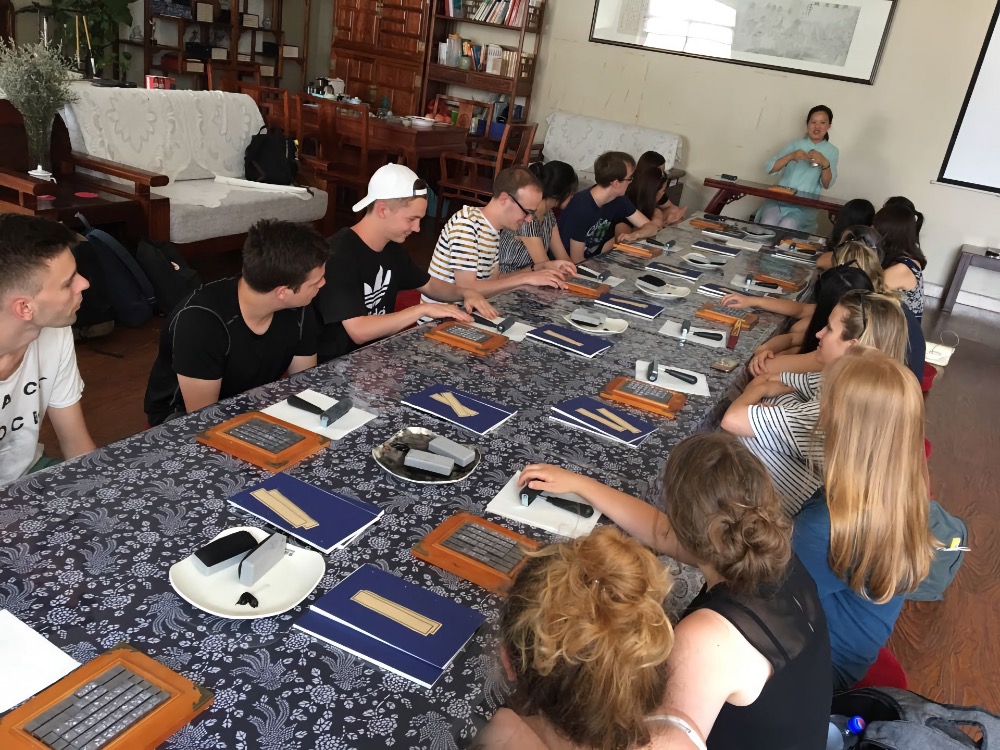 Students learn about traditional book binding techniques